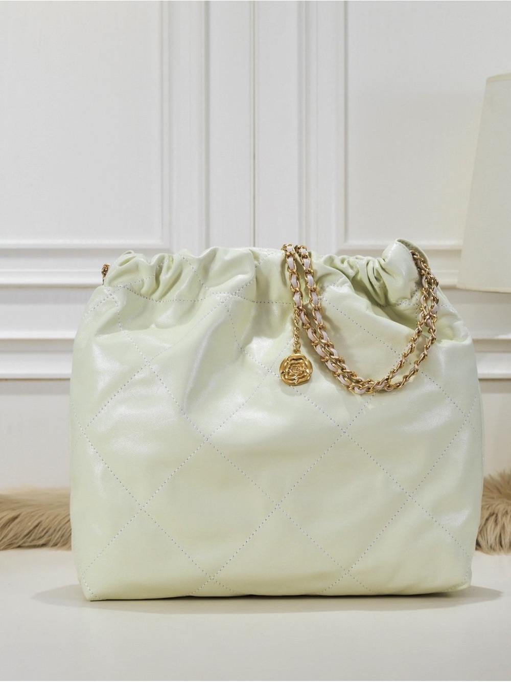 Quilted Drawstring Shoulder Bag in Off White with Gold Chain